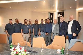 A group photo of the entire team proudly posing in India 