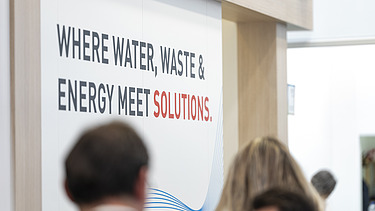 A focused shot highlighting the core message of the exhibition booth: 
