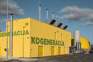 A bright yellow industrial building with the word 