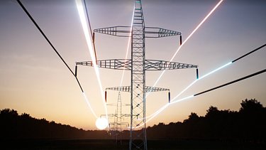 Steel transmission towers stretch across a forest at sunset while glowing colorful strands symbolize data-intensive artificial intelligence increasing power consumption.